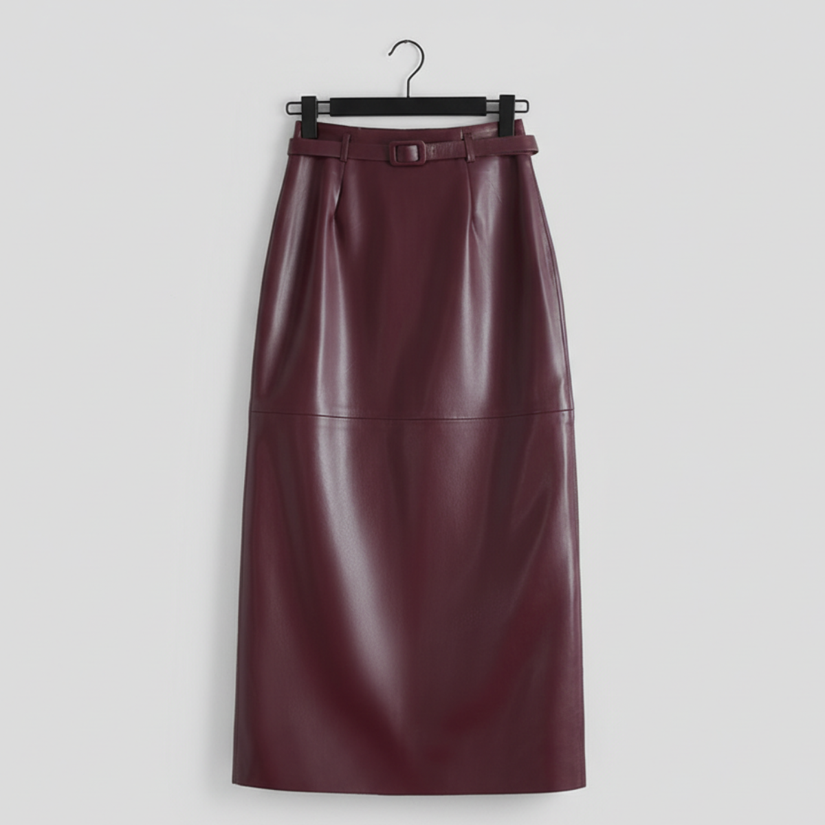 Women's high-waisted faux leather skirt with buckle belt
