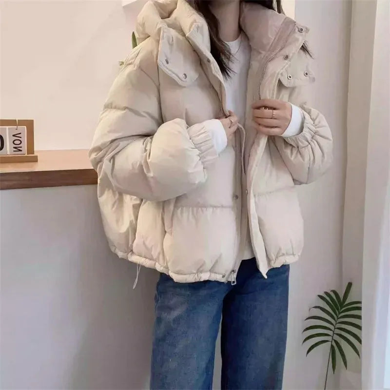 Women's puffer jacket with a stand collar and insulated hood for extreme cold