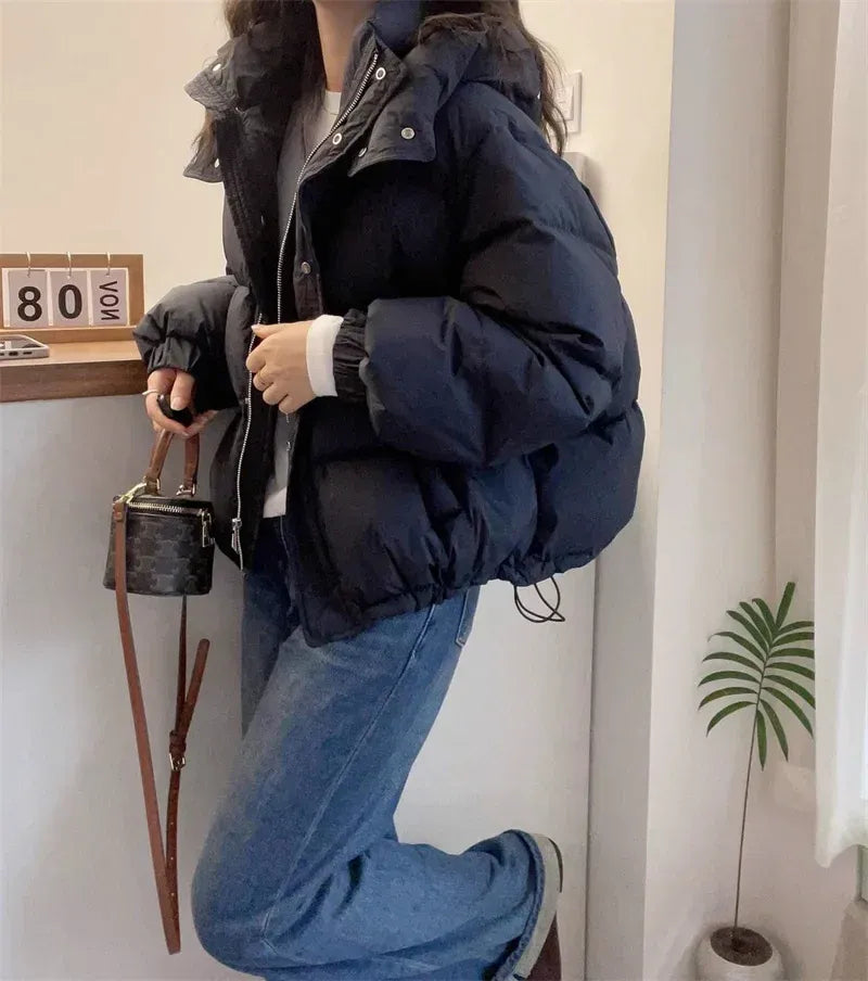 Women's puffer jacket with a stand collar and insulated hood for extreme cold