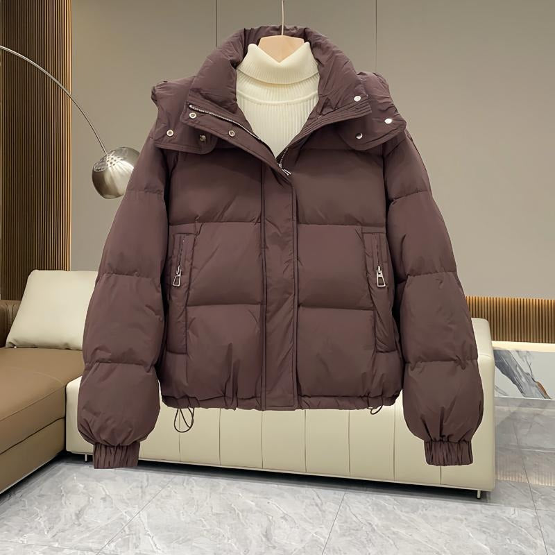 Women's puffer jacket with a stand collar and insulated hood for extreme cold