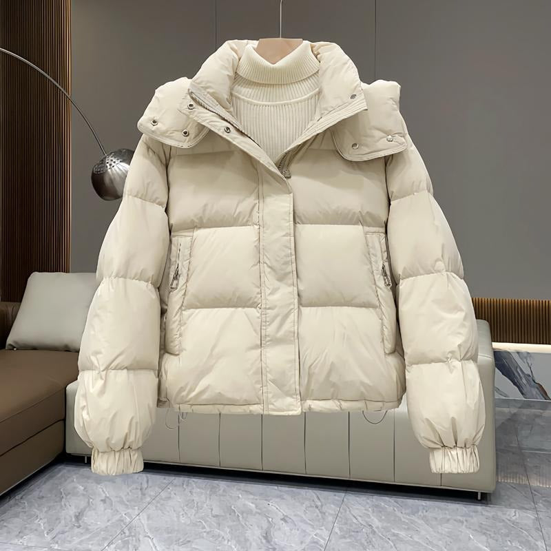 Women's puffer jacket with a stand collar and insulated hood for extreme cold