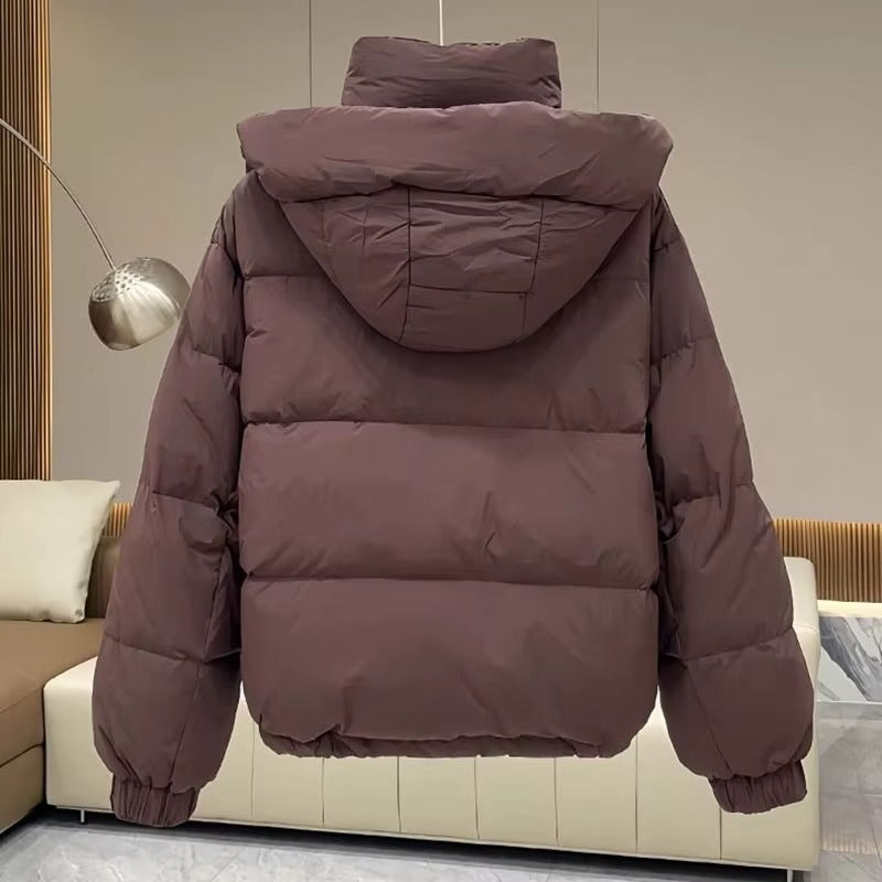 Women's puffer jacket with a stand collar and insulated hood for extreme cold