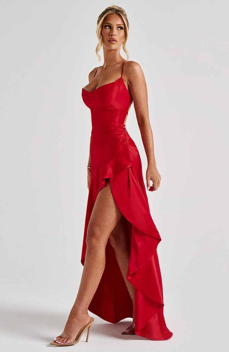 Women's maxi dress with thin straps, ruffled hem, and romantic style