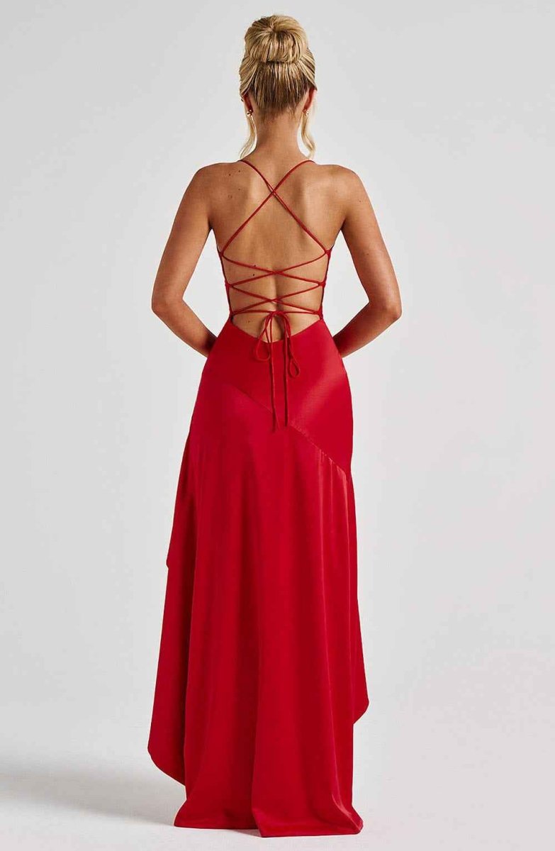 Women's maxi dress with thin straps, ruffled hem, and romantic style