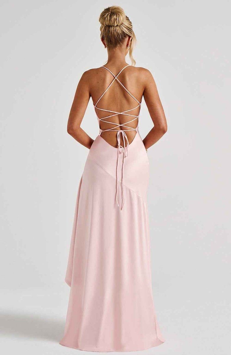 Women's maxi dress with thin straps, ruffled hem, and romantic style