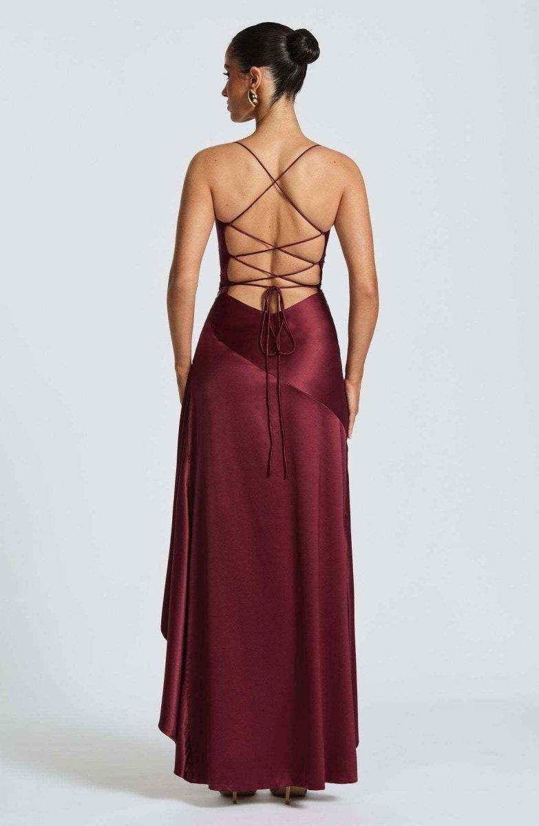 Women's maxi dress with thin straps, ruffled hem, and romantic style