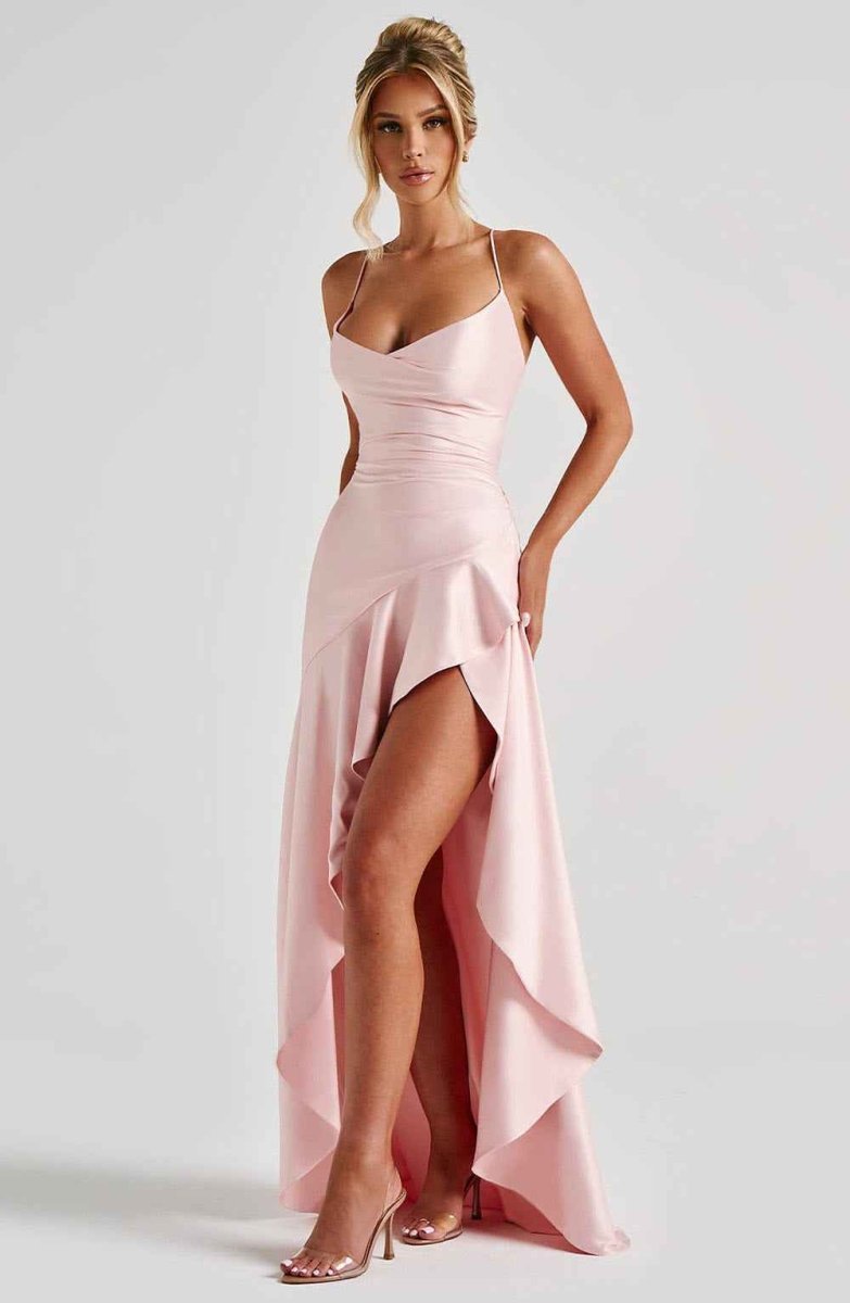 Women's maxi dress with thin straps, ruffled hem, and romantic style