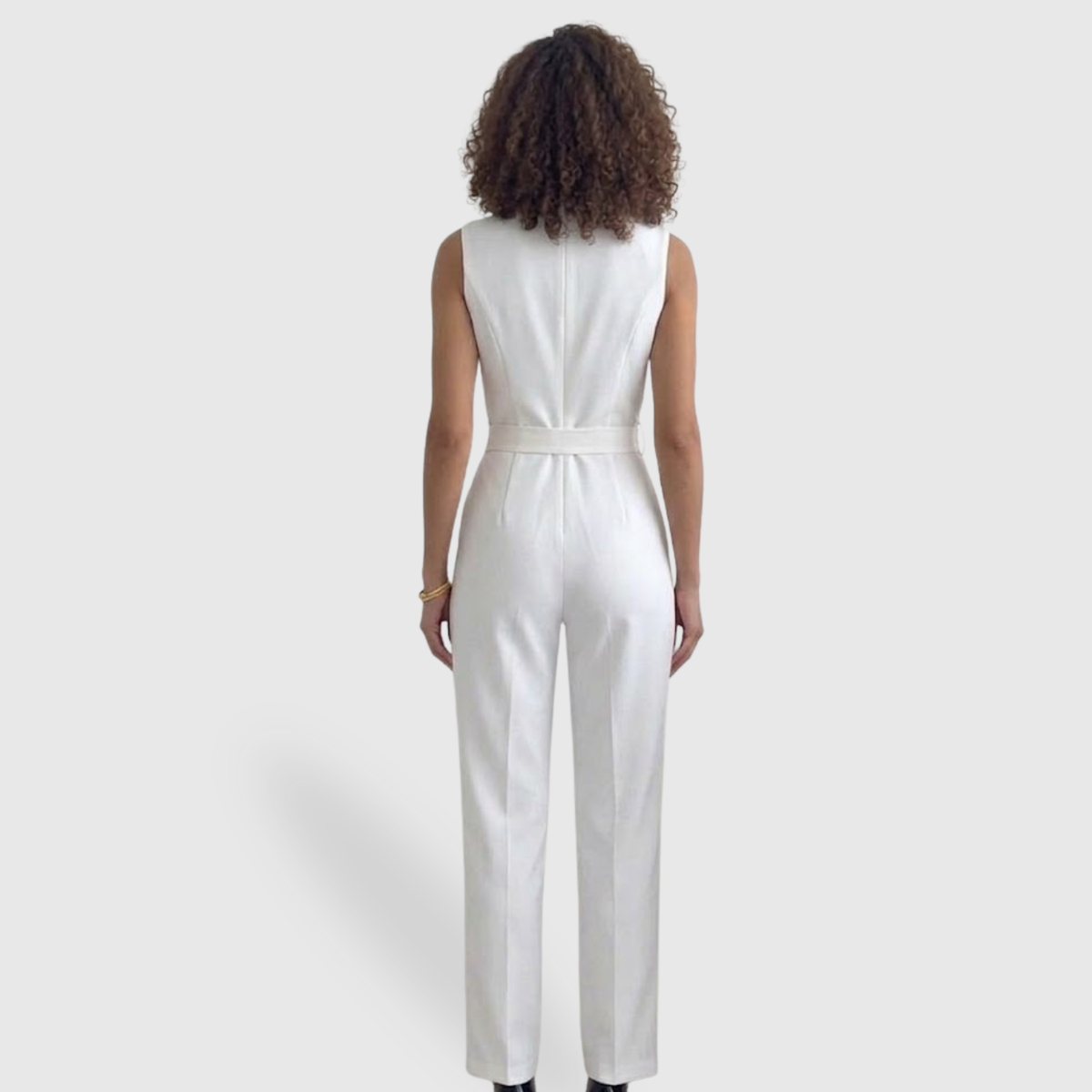 Tuta elegante da donna con pantaloni a vita alta, senza maniche e dal taglio fluido