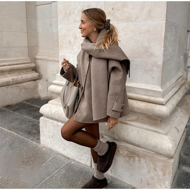 Women's oversized casual winter jacket with hood and front button closure