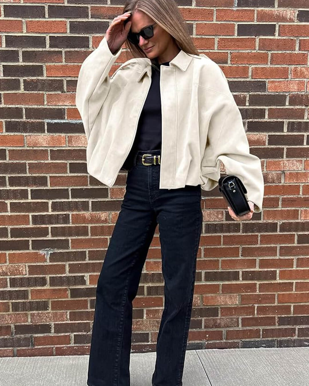 Bomber femme faux daim col structuré finition mate élégante