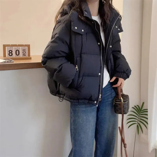 Women's puffer jacket with a stand collar and insulated hood for extreme cold