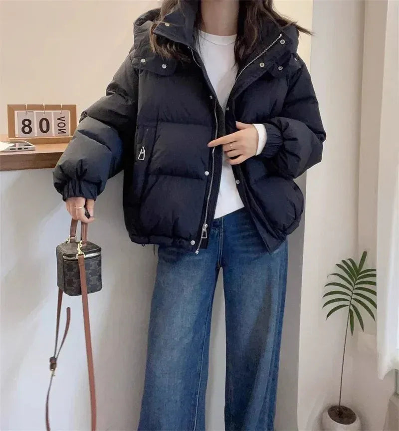 Women's puffer jacket with a stand collar and insulated hood for extreme cold