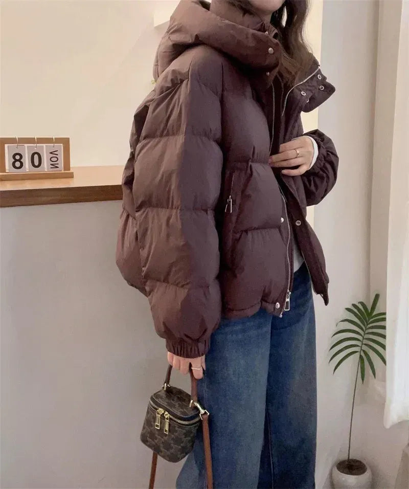 Women's puffer jacket with a stand collar and insulated hood for extreme cold