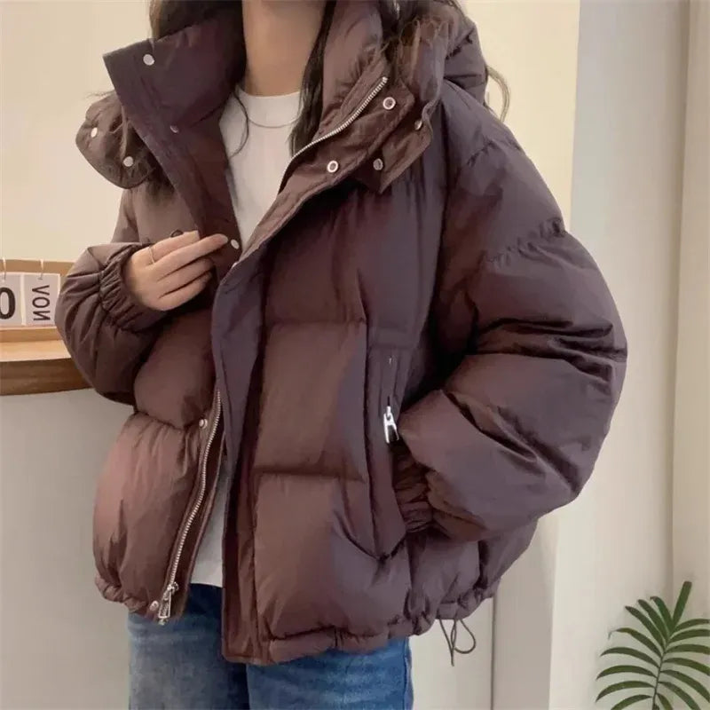 Women's puffer jacket with a stand collar and insulated hood for extreme cold