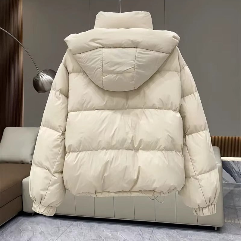 Women's puffer jacket with a stand collar and insulated hood for extreme cold