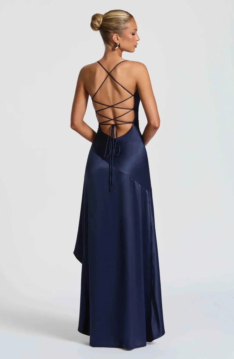 Women's maxi dress with thin straps, ruffled hem, and romantic style