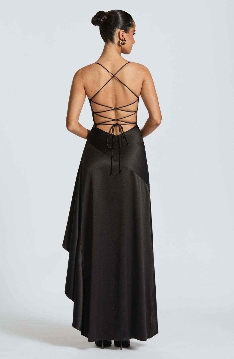 Women's maxi dress with thin straps, ruffled hem, and romantic style