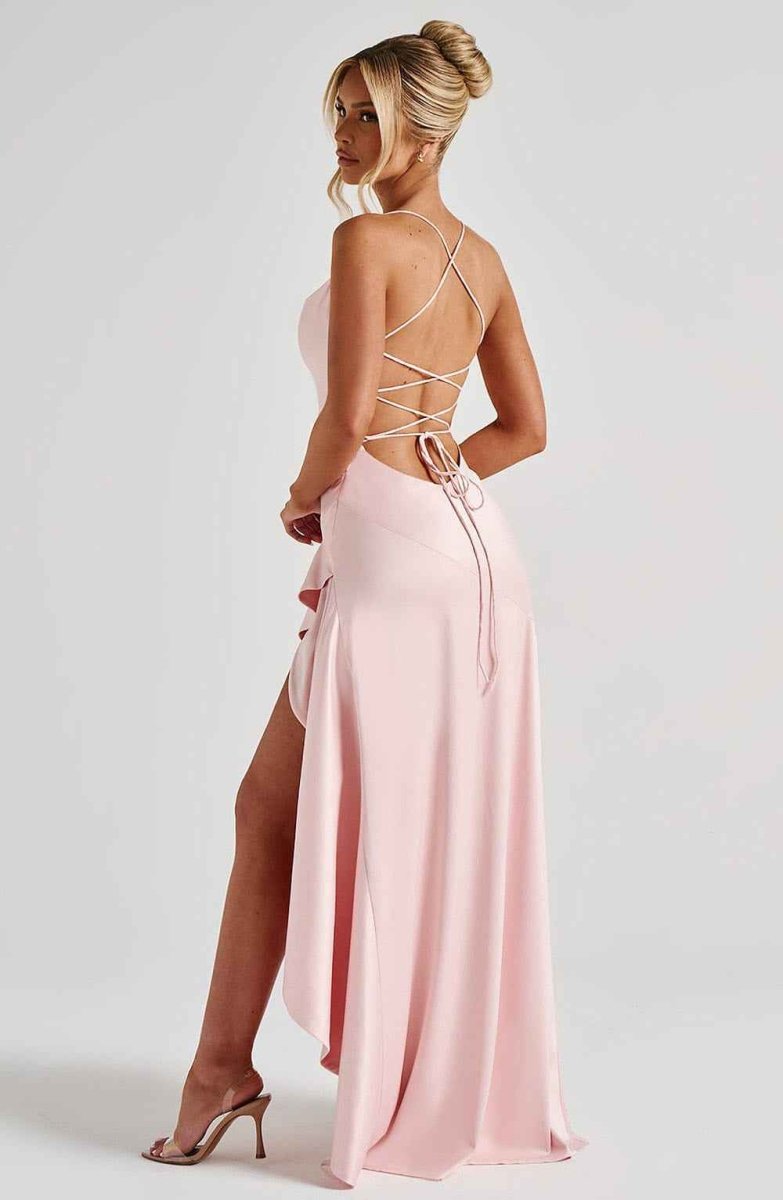 Women's maxi dress with thin straps, ruffled hem, and romantic style