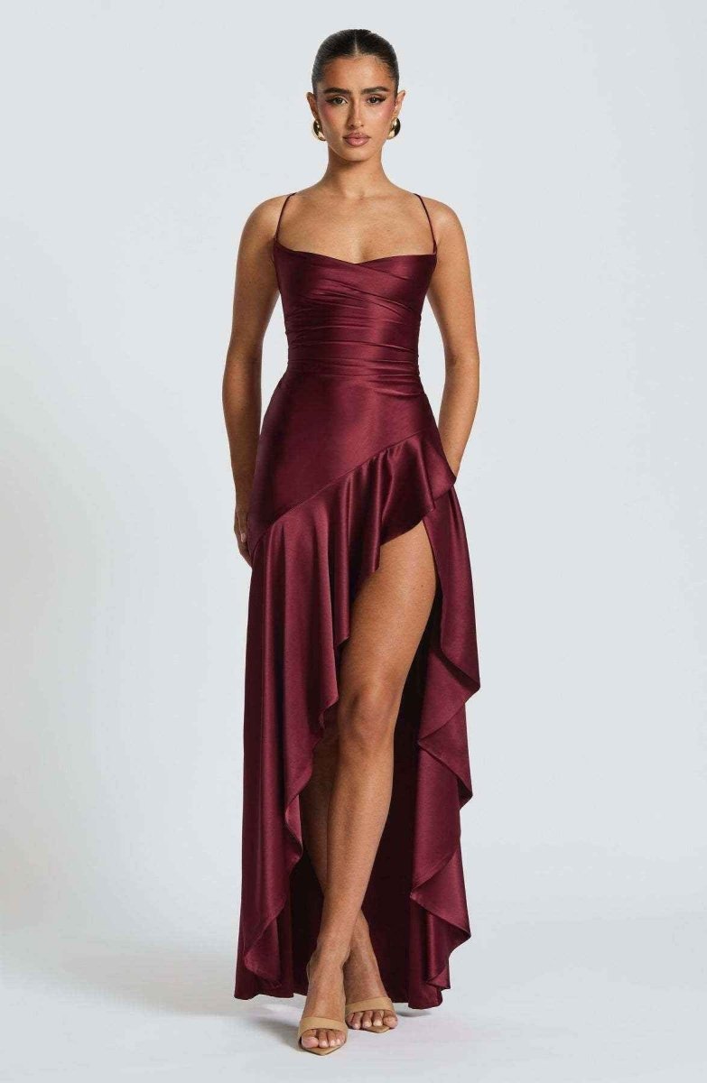 Women's maxi dress with thin straps, ruffled hem, and romantic style