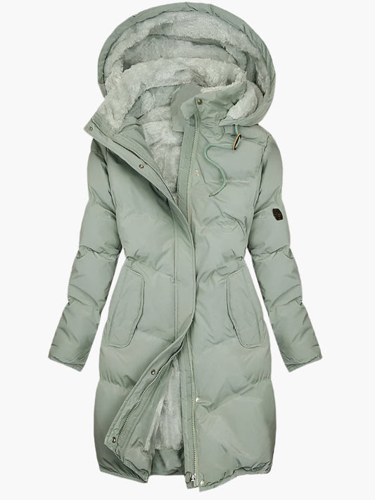 Elegant long winter women's coat with faux fur hood
